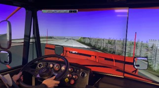 student testing the enhanced truck-driving simulator 