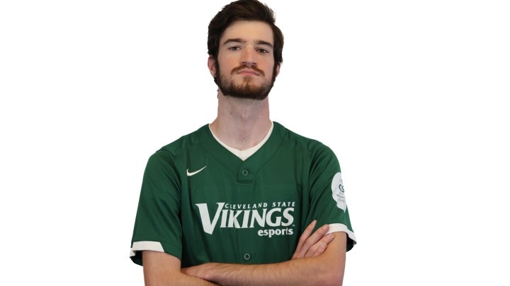 Esports player Aidan crossing his arms