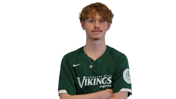Esports player Ashton crossing his arms