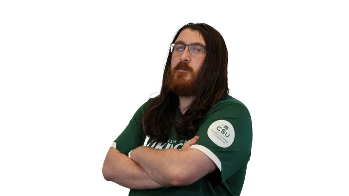 Esports player Cole crossing his arms