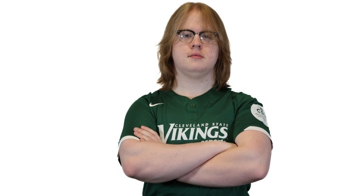 Esports player Isaac crossing his arms