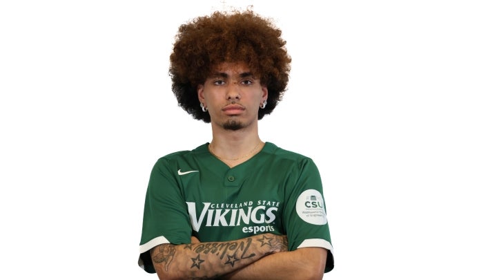 Esports player Jacob crossing his arms