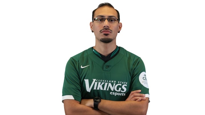 Esports player Junior crossing his arms