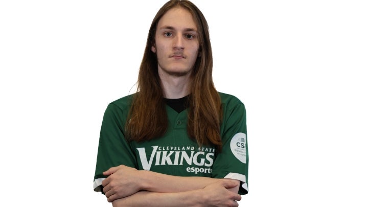 Esports player Reid crossing his arms