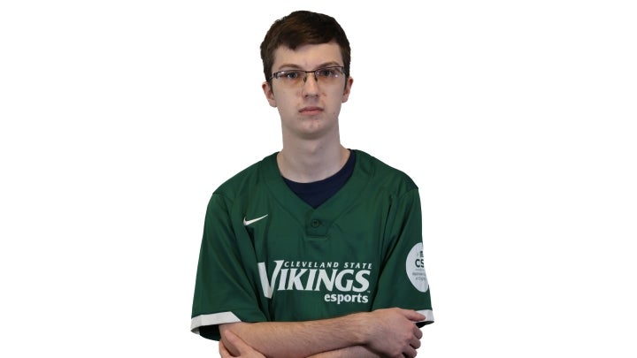 Esports player Tim crossing his arms