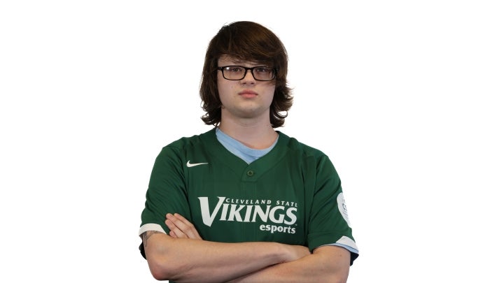Esports player Corey crossing his arms