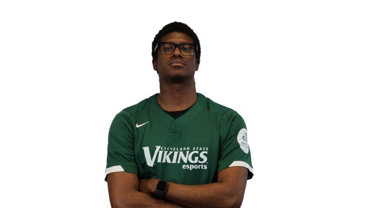 Esports player Michael crossing his arms