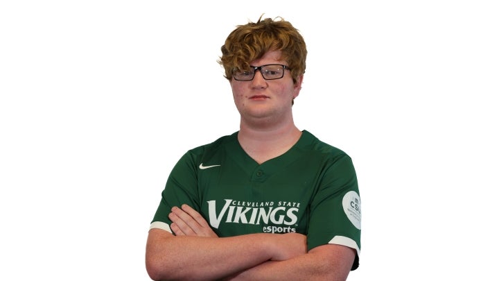 Esports player Willcrossing his arms