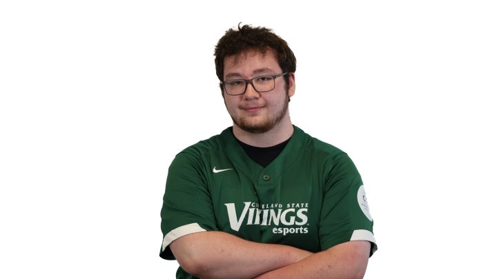 Esports player Collin crossing his arms