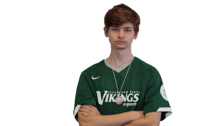 Esports player Gavin crossing his arms