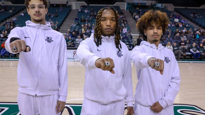 Rocket league showing off ring at basketball game 
