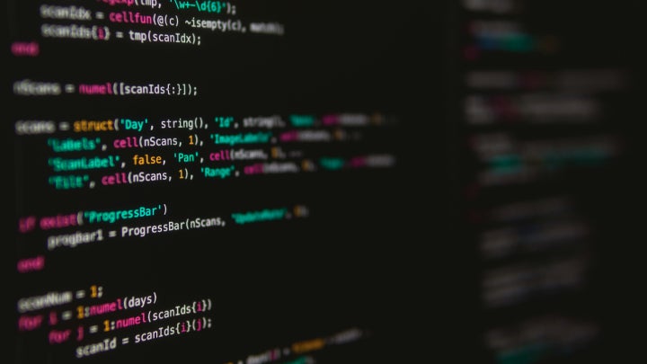 A monitor displaying programming code.