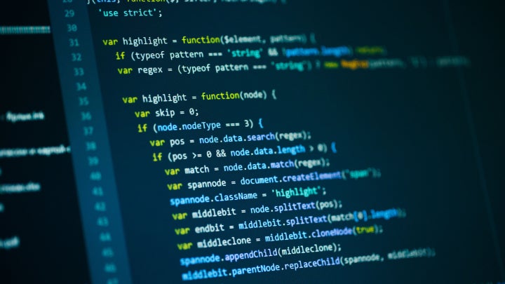 A monitor displaying programming code.