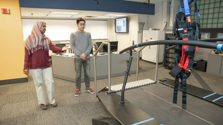 Two research students working in a lab.