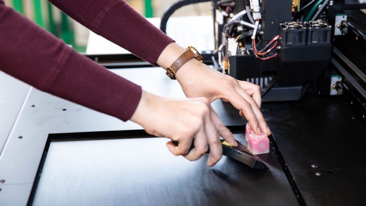 A student working on research equipment.