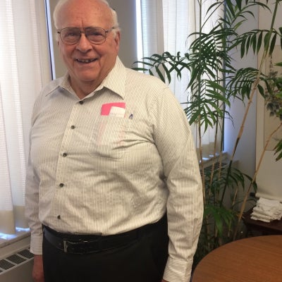 Donald J Harvey posing for a photo indoors.