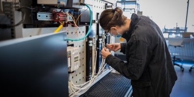 A student working on research in a lab.