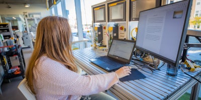 A student working on research in a lab.