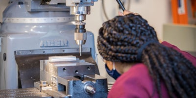 A student working on research in a lab.
