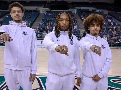 Rocket league showing off ring at basketball game 