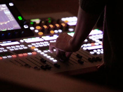 A person using audio equipment. 