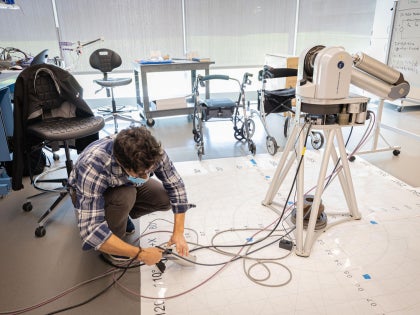 A student working on research in a lab.
