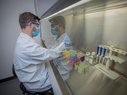 A research student working on research in a lab.