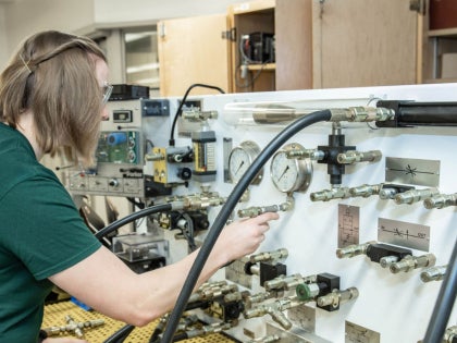 A student working on research in a lab.