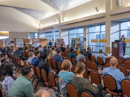 A large audience watching a presentation for the Senior Capstone on 2019.
