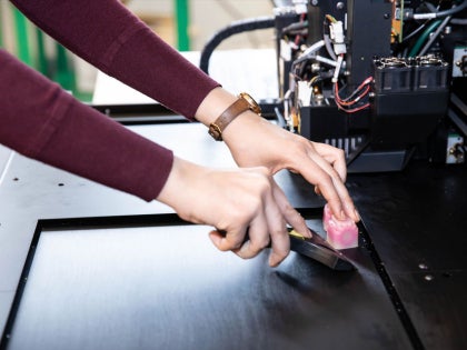 A student working on research equipment.
