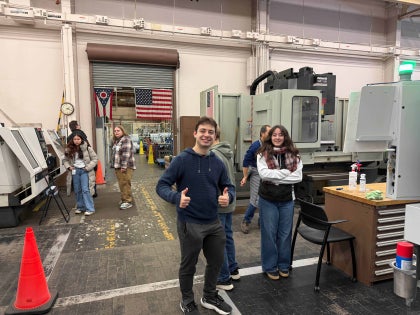 A group of students exploring a large facility.