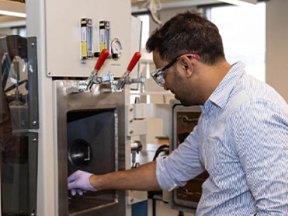 A student conducting research in a classroom.